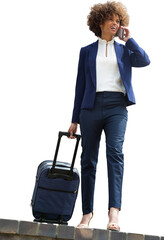 Businesswoman with luggage talking on phone