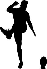 Rugby player kicking ball