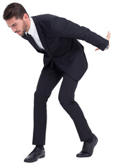 Businessman carrying something heavy with his back and hands