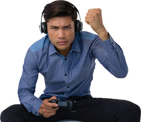 Businessman clenching fist while playing video game