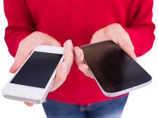 Woman holding two mobile phones