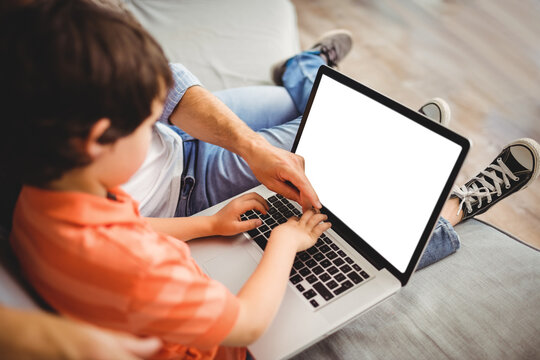 Father And Son Using Computer Together