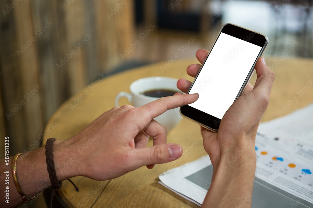 Aufkleber man using mobile phone at table in cafe