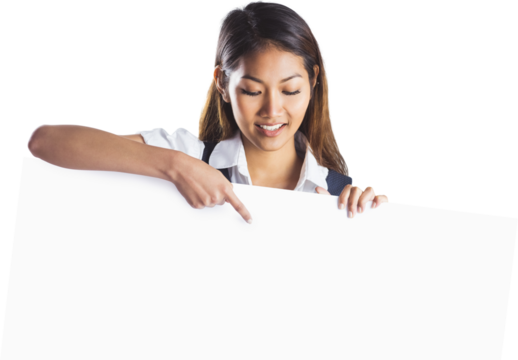 Smiling businesswoman pointing a white poster