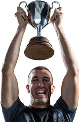 Portrait of successful rugby player holding trophy