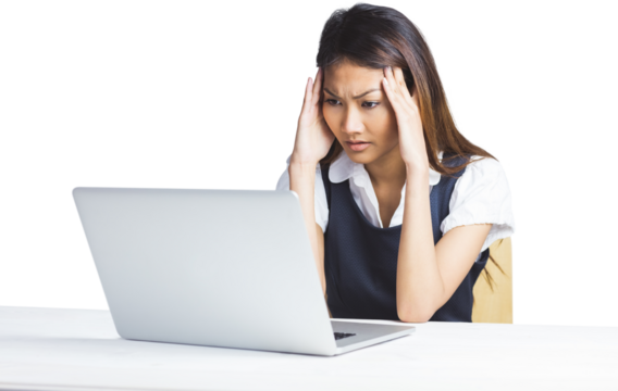 Nervous businesswoman using a laptop