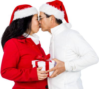 Festive senior couple exchanging gifts - Powered by Adobe