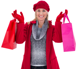 Blonde in winter clothes holding shopping bags