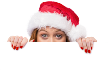 Festive redhead smiling at camera holding poster