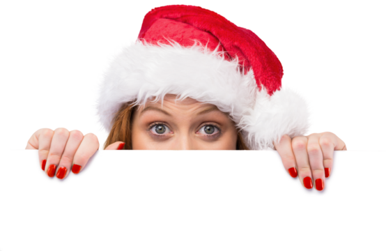 Festive redhead smiling at camera holding poster