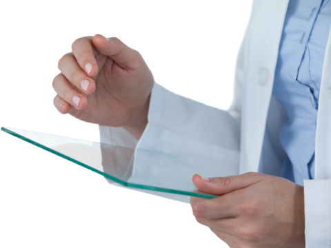 Midsection of female doctor using digital tablet