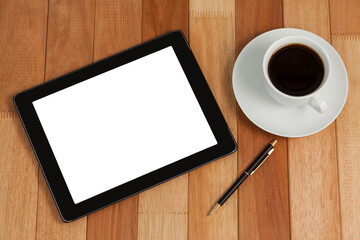 Digital tablet with pen and cup of tea