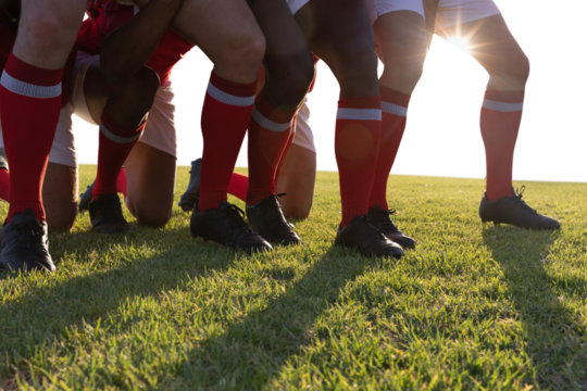 Male rugby players playing rugby in the ground