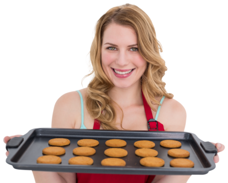 Smiling woman showing hot cookies - Powered by Adobe