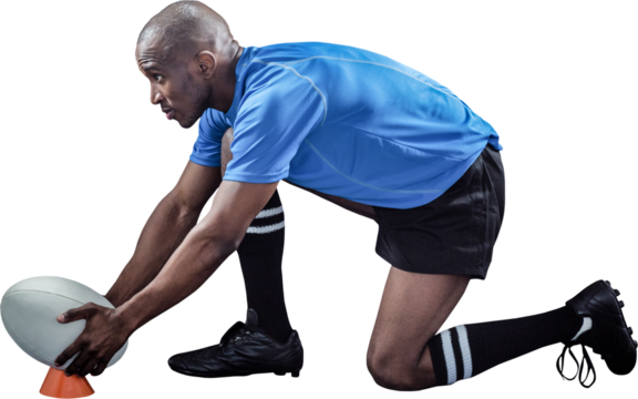 Rugby player keeping ball on kicking tee