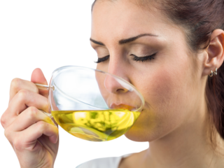 Beautiful woman drinking herbal tea