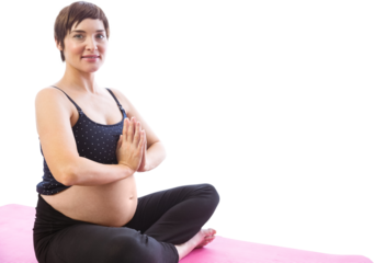 Portrait of pregnant woman meditating in lotus pose