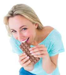 Tuinposter Pretty blonde eating bar of chocolate © vectorfusionart