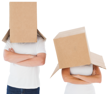Mature couple wearing boxes over their heads