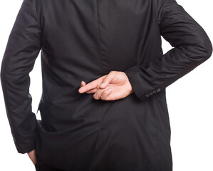 Midsection of businessman with crossed fingers