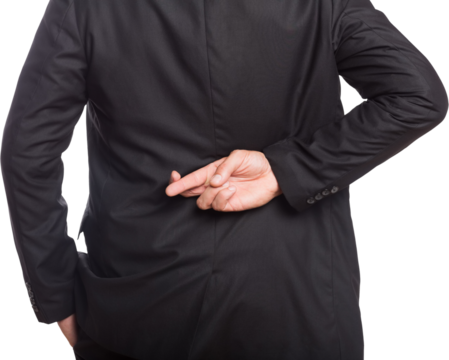 Midsection of businessman with crossed fingers - Powered by Adobe