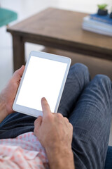 Mid section of male executive using digital tablet in office