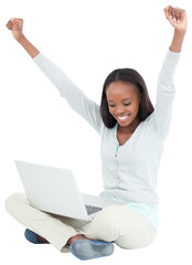 Young woman stretching while on the floor with her laptop