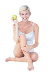 Sitting woman holding an apple 