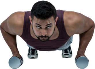 Muscular man doing push ups with dumbbells