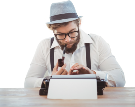 Hipster smoking pipe while working at desk