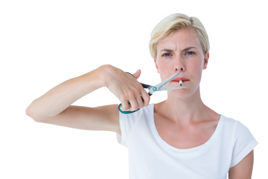 Attractive blonde woman cutting cigarette with scissors - Powered by Adobe