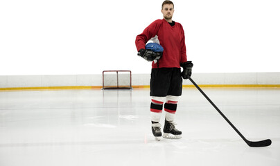 Obraz premium Portrait of ice hockey player holding helmet and stick