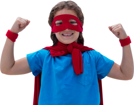 Portrait of boy clenching fists in cape and mask