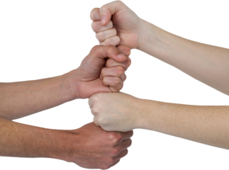 Cropped image of people with stacked fists