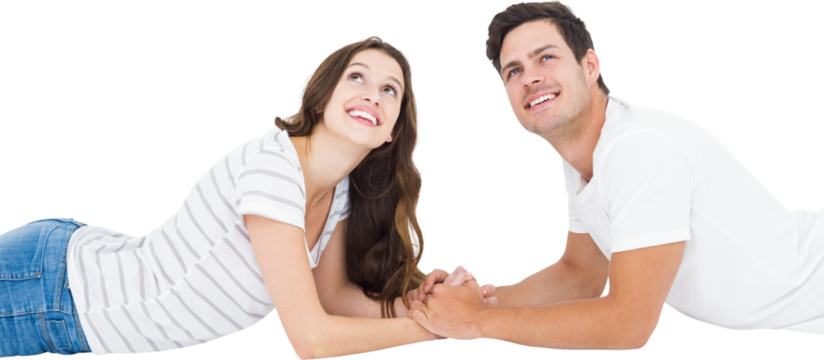 Happy couple lying on floor and looking up