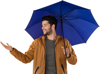 Young man gesturing while holding blue umbrella