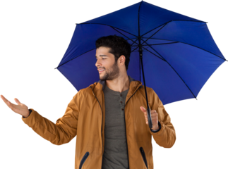 Young man gesturing while holding blue umbrella
