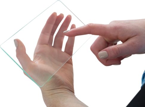 Cropped hand of businesswoman touching glass interface