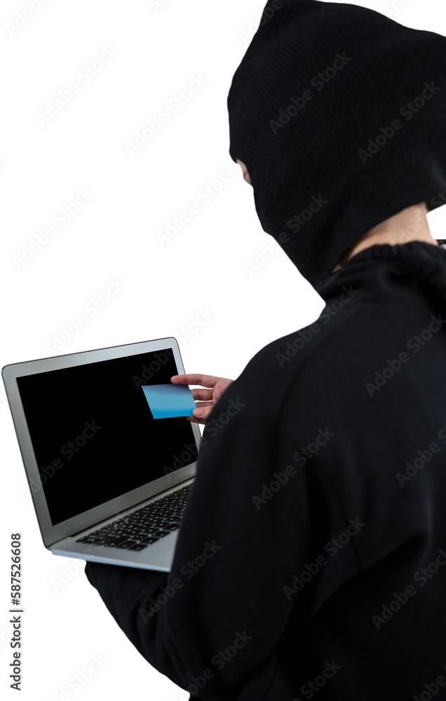 Aufkleber rear view of hacker using laptop and credit card