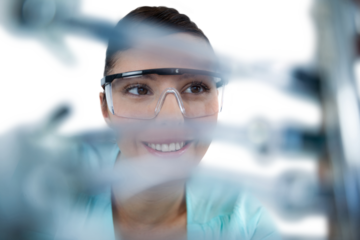 Happy computer engineer repairing computer motherboard