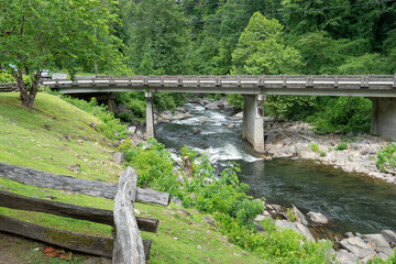 state highway bridge over a river crossing high in the Appalachian region of the Eastern United States in more rural country areas, the ice and show melt run freshwater downstream