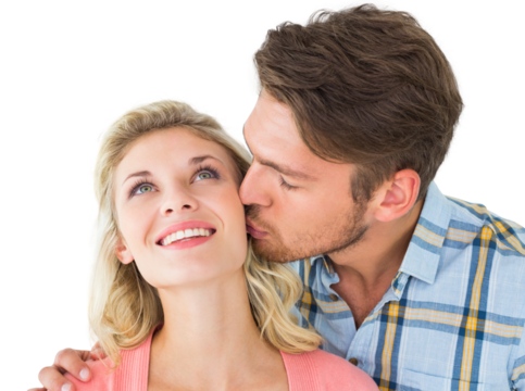 Handsome man kissing girlfriend on cheek