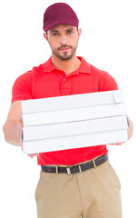 Handsome delivery person giving pizza boxes