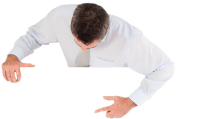 Businessman pointing at something on a blank panel