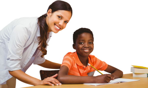 Teacher assisting boy with homework in library