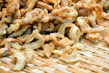 Pork rinds or deep fried pork skin.