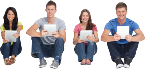 A group of people holding tablets as they look at the camera