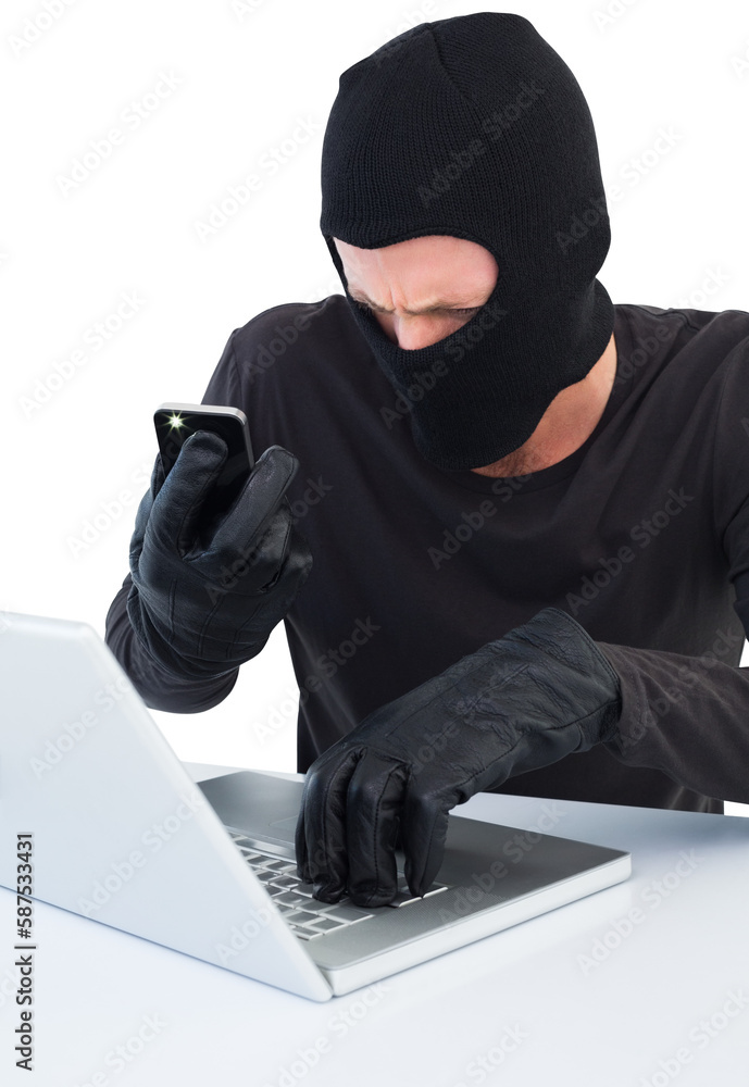 Poster hacker using laptop and phone