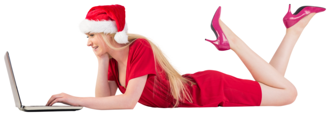 Festive blonde using a laptop