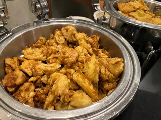Gorengan which is popular fried food in Indonesia being served in chafing dish.